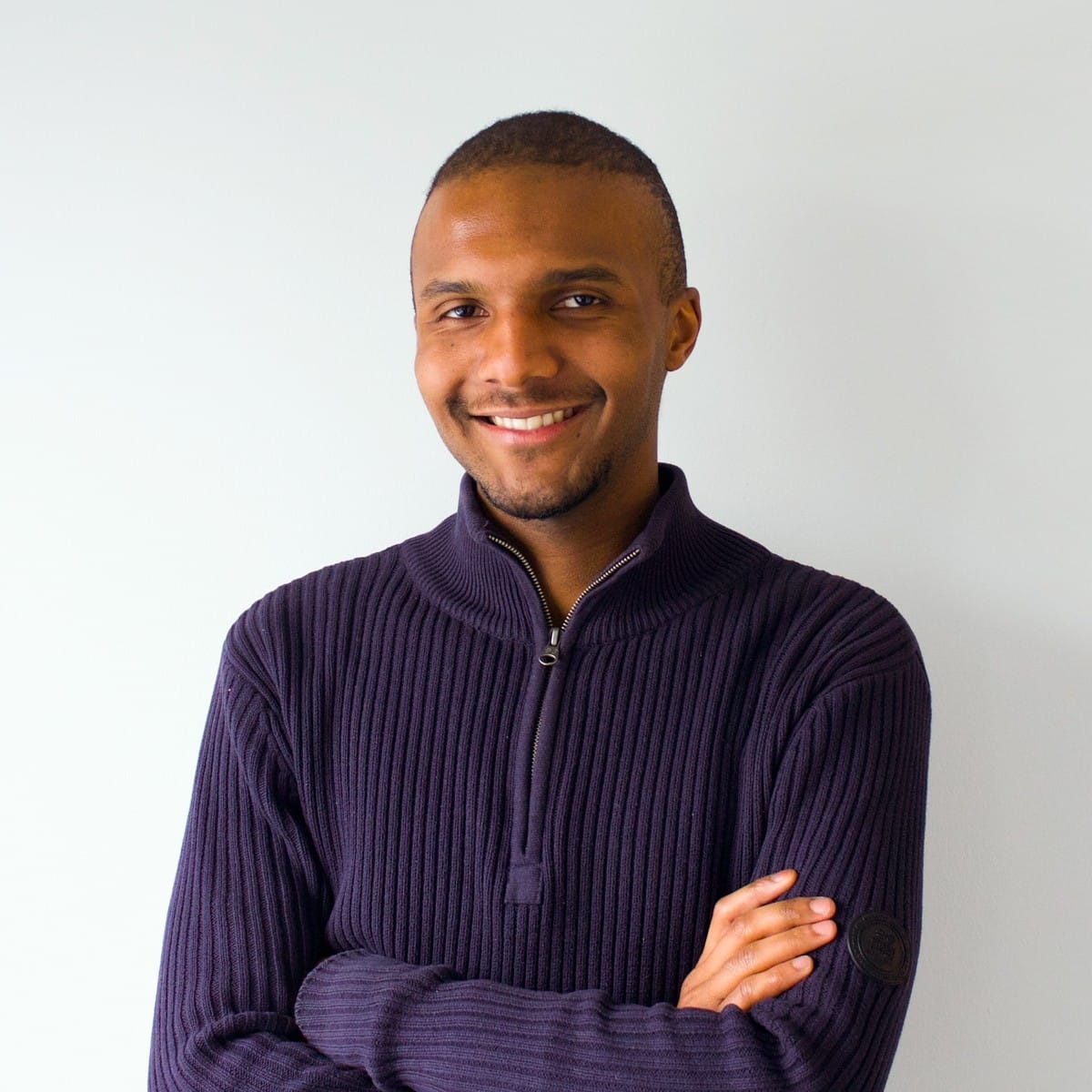 photo of a man wearing a blue sweater