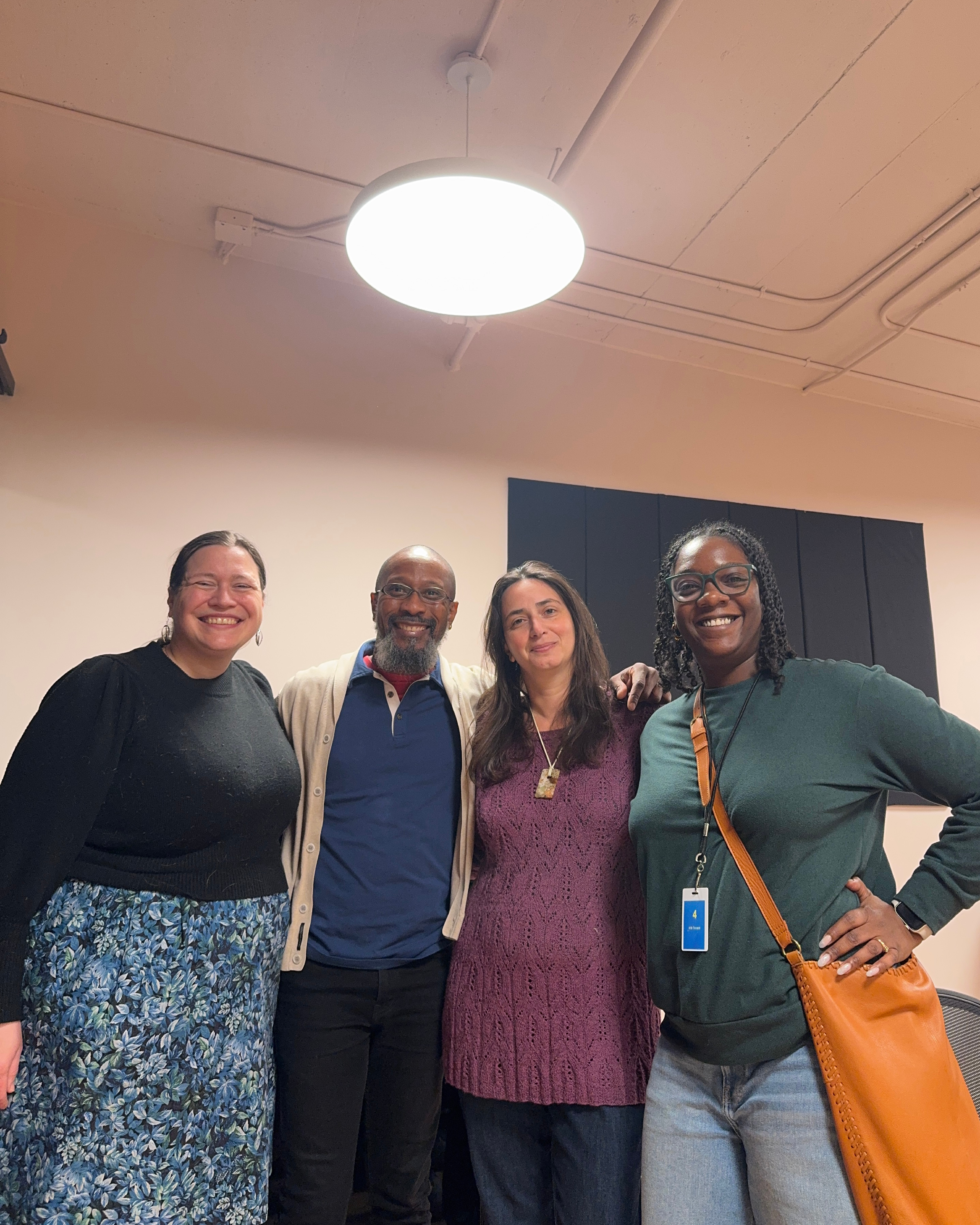 3 women and one man in a studio